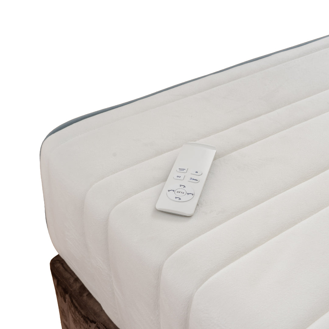 Adjustable bed with a remote control on a white background