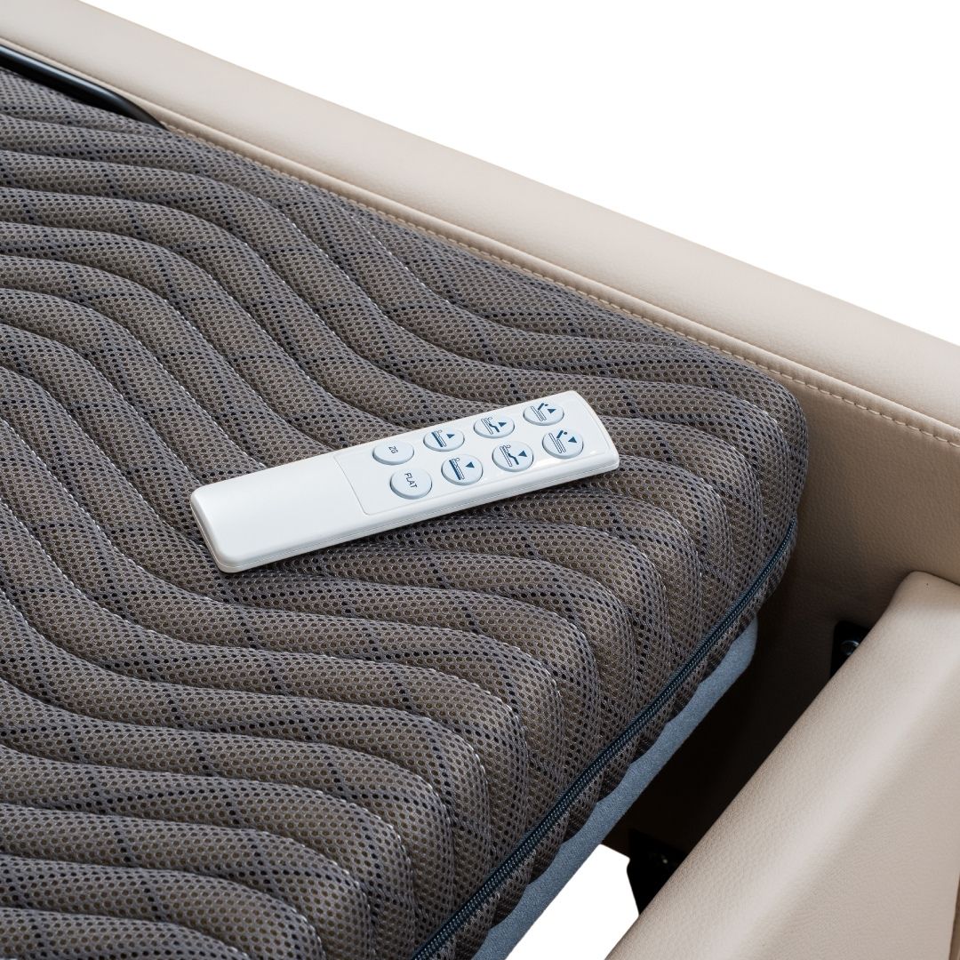 Massage cushion with remote control on a white background